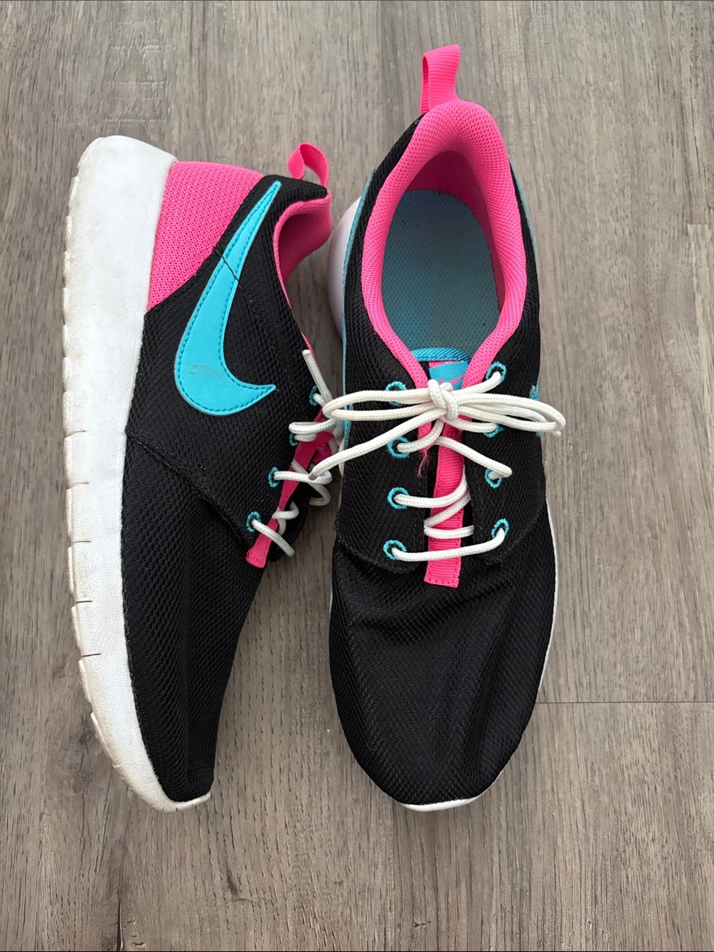 Nike Women’s Black Sneakers with Pink Lining and Teal Swoosh